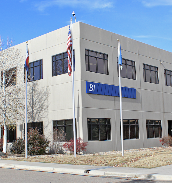 An exterior photograph of the BI Incorporated headquarters, highlighting the building's design and environment.